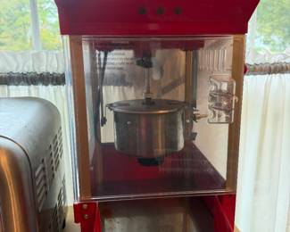 Red tabletop theater style popcorn machine