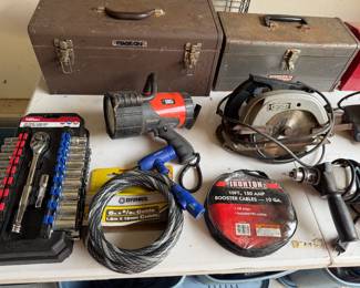Metal tool boxes, circular saws, socket set and booster cables