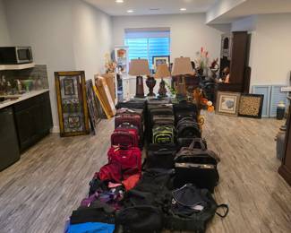 Large assortment of soft and hard-shell luggage, duffel bags, and backpacks