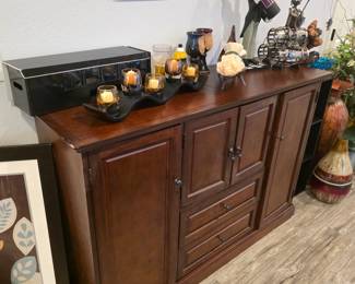 Dark cherry wood buffet credenza with multi-compartment storage cabinets and center drawers,