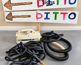 Lot 12 Vacuum, water hose, signs