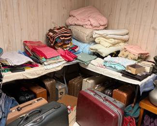 Large amounts of clothing, luggage, linens etc