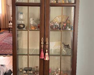 Tall narrow lighted Curio cabinet
