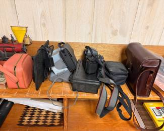 cameras, binoculars etc