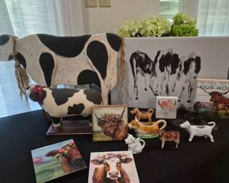 Cow pictures, creamers, and decor