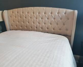 Tufted queen headboard with mechanical platform.