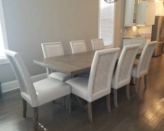 Contemporary pedestal dining table and chairs