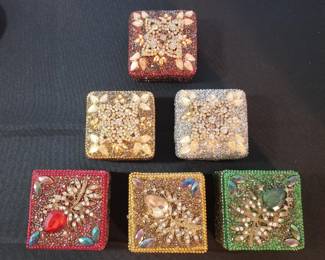 Crystal accented tin boxes.