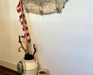Vintage walking sticks, milk cans, and pottery 