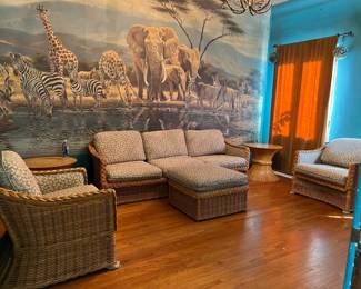 Here we have another living room set, in this case a wicker set.  If nothing else, come see the wall mural.
