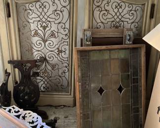 The easiest item in this photo is the framed stained glass window.  Behind you can see a pair of matching ornate "saloon doors".