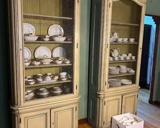 The two matching china cabinets (and the china) can be seen here.  There are mesh screens in front of the cabinet shelves.  There's also a banker's box that wanted to be in the picture.
