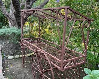Outside again, there is a very decorative cart.  This could be a decent gardening center, or just let in spruce up your garden.