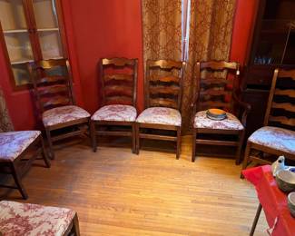 In this photo, you can see seven matching dining chairs (there might be an eighth chair out of frame).