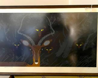 The image is tricky to see, but there are four big cats and an antelope of some variety in this image.