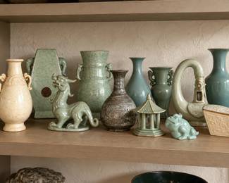 Curated Celadon Ceramics on a Warm Shelf