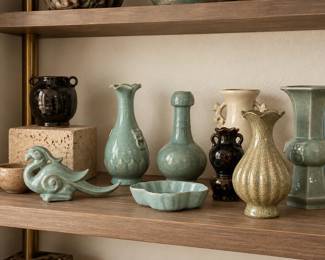 Curated Celadon Ceramics on Wooden Shelves