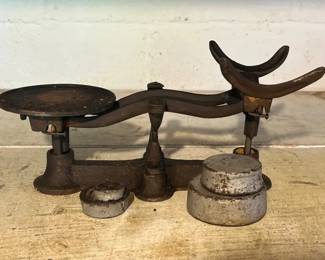 Antique cast iron balance scale with weights