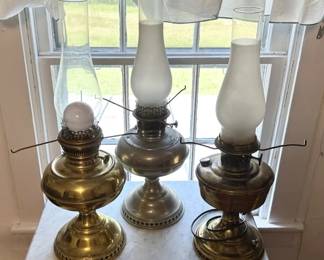 Brass oil lamps with glass chimneys