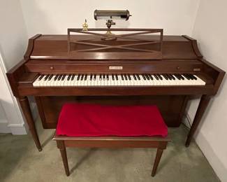 Baldwin piano with bench, music clip and lamp