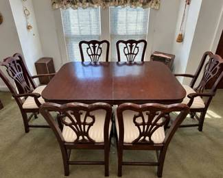 Mahogany Duncan Phyfe double pedestal dining table with two Chippendale style captain's chairs and four side chairs