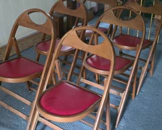 Set of vintage wooden bentwood-style folding chairs with padded red vinyl seats and brass details