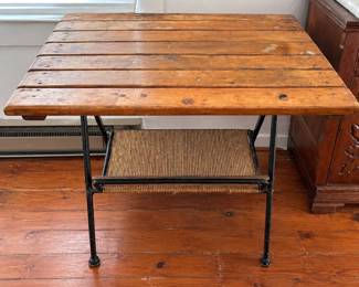 Vintage slatted wood top side table with steel frame and woven magazine rack