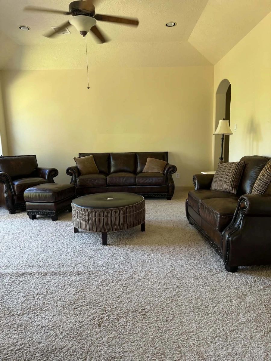 Living room furniture featuring leather sofas, armchairs and coffee table | Wildflower Lane Estate Sales | Sugar Land, TX