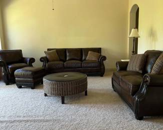 Living room furniture featuring leather sofas, armchairs and coffee table | Wildflower Lane Estate Sales | Sugar Land, TX