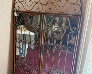 Large iron mirror