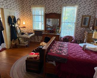 Bedroom filled with vintage clothing