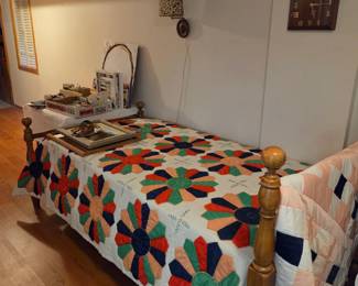 Twin bed with another beautiful quilt