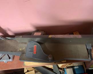 Shopsmith wood jointer attachment, showing signs of light surface dust and wear from use.