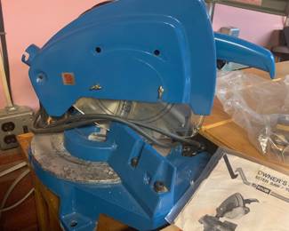 Vintage Ryobi TS-251U blue compound miter saw with original owner's manual.