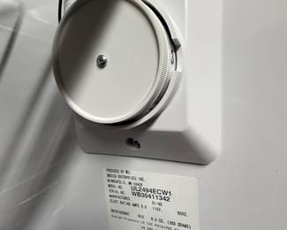 Internal temperature control dial and manufacturer specification label for a WCI commercial freezer, model UL2494ECW1, manufactured in 1993.