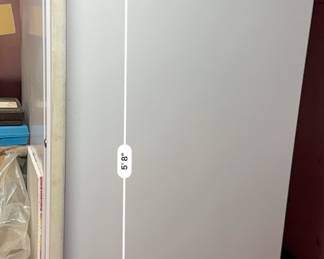 White Imperial upright frost-free freezer measuring 5 feet 8 inches tall.