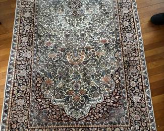 Hand-Knotted Floral Area Rug: Traditional floral-pattern area rug with intricate multicolor design.
