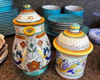 The Art of Deruta — Hand-Painted Italian Pottery & Colorful Tableware  A stunning collection featuring authentic Deruta pottery and other beautifully decorated Italian ceramics. Rich Mediterranean colors, intricate Raffaellesco-style motifs, and exquisite floral detailing showcase the artistry of traditional Italian pottery. Featuring ornate lidded vessels, decorative serving pieces, and a vibrant selection of complementary tableware. A colorful celebration of Italian craftsmanship and timeless European charm.