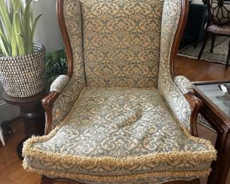 Beautiful traditional armchair featuring a carved wood frame and patterned upholstery. Decorative detailing gives this chair plenty of character and makes it a great statement piece.