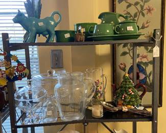 Lots of serving pieces, teapots and glassware.