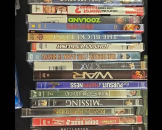 DVD Movie Collection Assorted DVDs featuring action, comedy, drama and family movies.