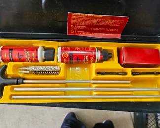 Gun Cleaning Kit Outers firearm cleaning kit with rods, brushes, cleaning solution and carrying case.