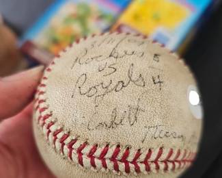 Vintage Autographed Baseball Older baseball featuring multiple handwritten signatures. Sports memorabilia.