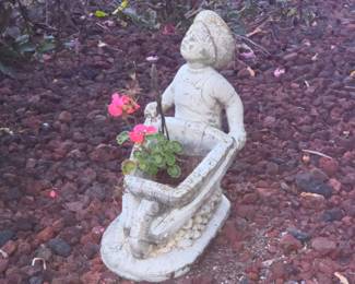 several lawn deco statuary statues