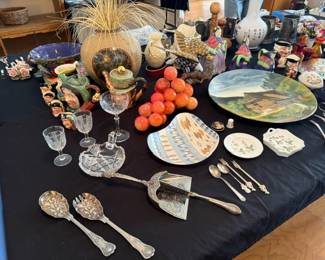 Lots of ornate large and small utensils, orange glass grapes, large platter, Royal Doultan mugs