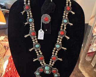 Nice sterling turquoise and coral squash blossom with matching bracelet and ring.  Has some age to it!