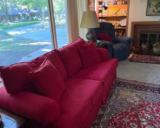 A view of the living room with the wonderful red sofa.