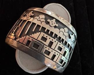 We all loved this cuff bracelet!  Very heavy, and interesting pueblo theme with peering mudheads! :)