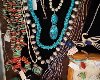 A selections of silver and Native American jewelry.