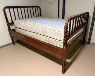 Antique Bed with Mattress and Box Spring (I believe the mattress & Box Spring is a full size) but the bed frame can hold a larger mattress (basement)